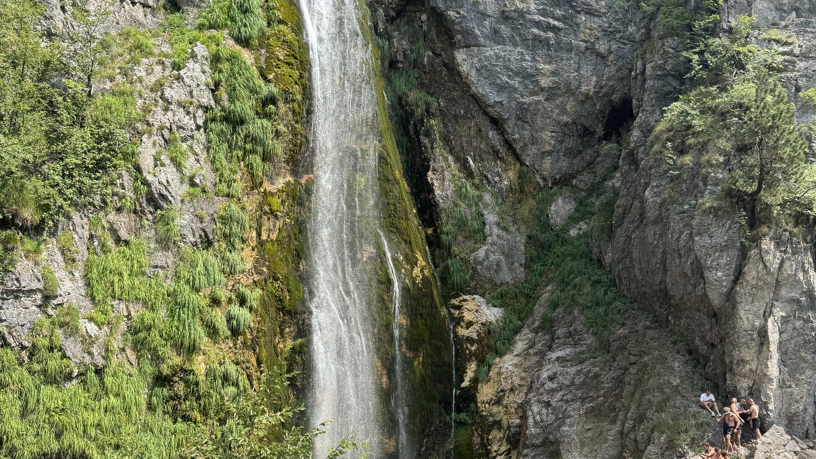 Grunas Waterfall falling into a rocky gorge near Theth in the Albanian Alps