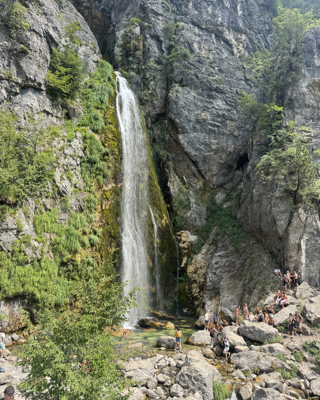 Grunas Waterfall falling into a rocky gorge near Theth in the Albanian Alps