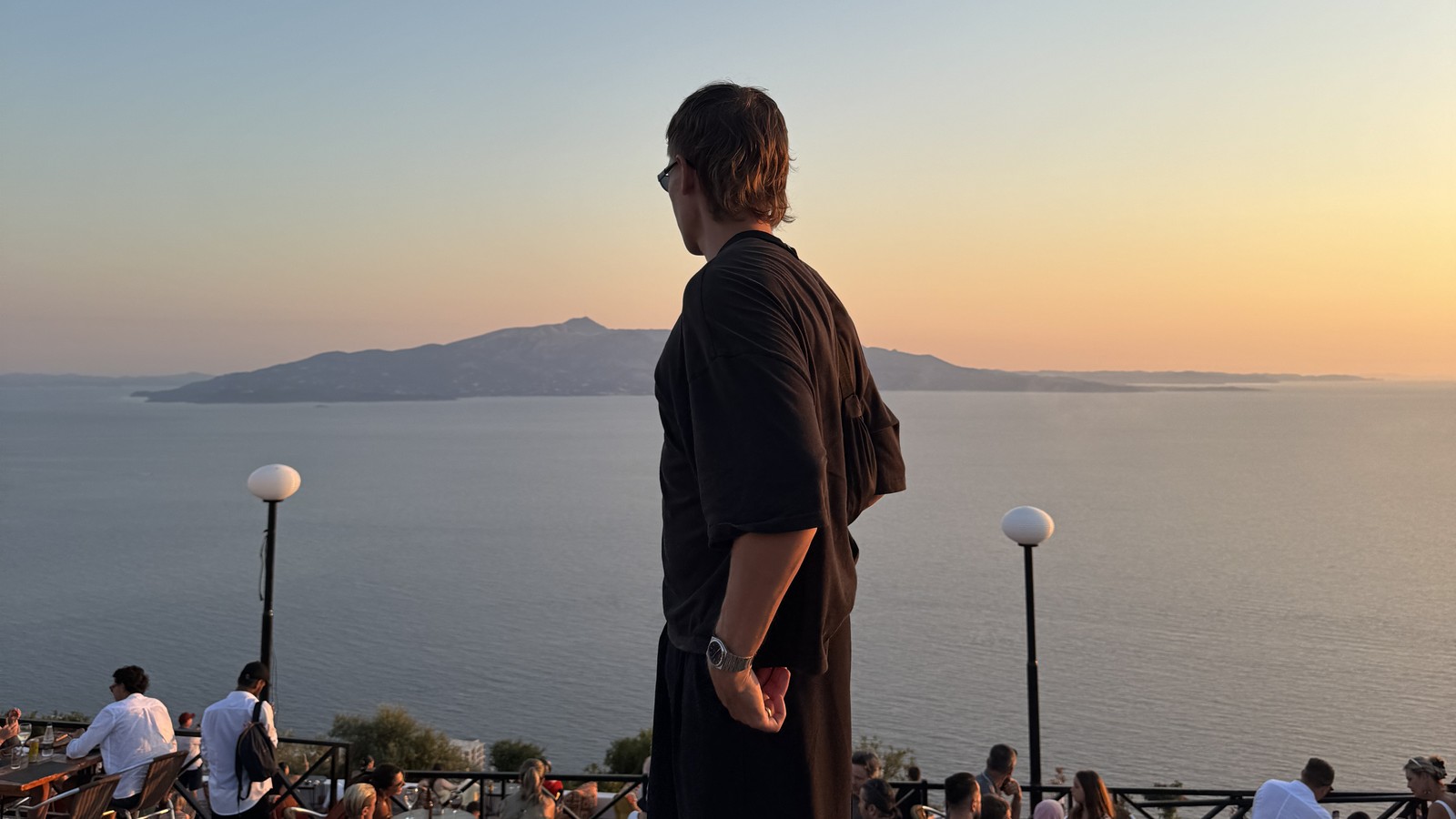 Daniel looking out over the bay from Lekuresi Castle above Sarande at sunset, Albania