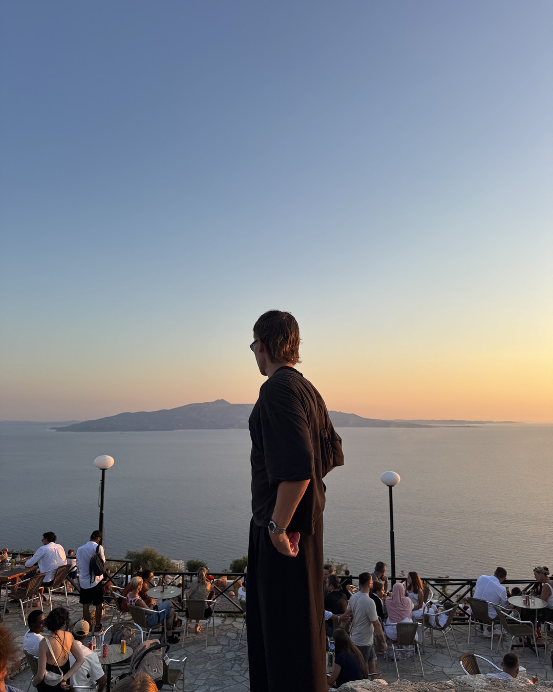 Daniel looking out over the bay from Lëkurësi Castle above Sarandë at sunset, Albania
