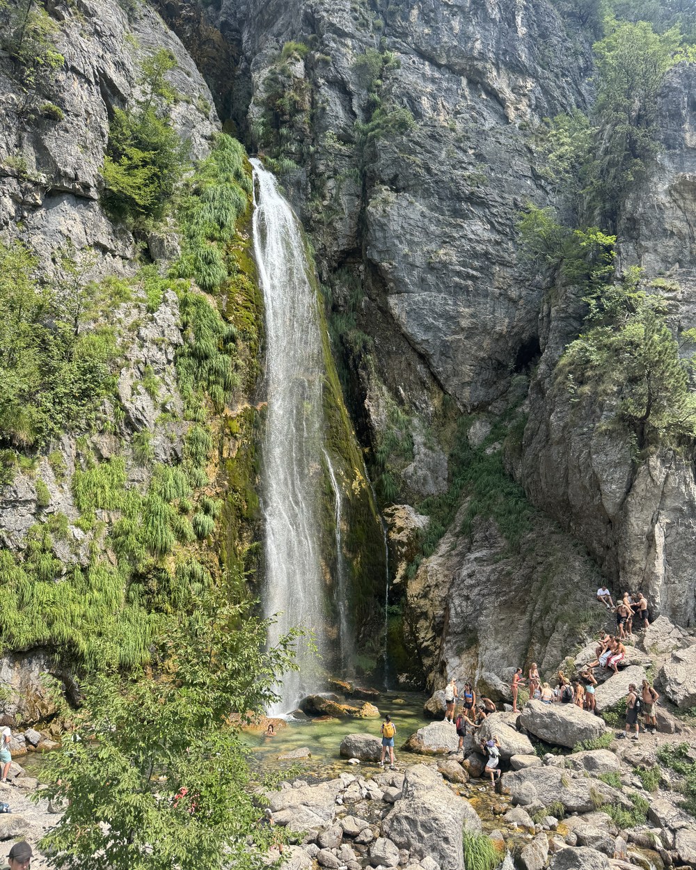 Grunas Waterfall falling into a rocky gorge near Theth, Albania
