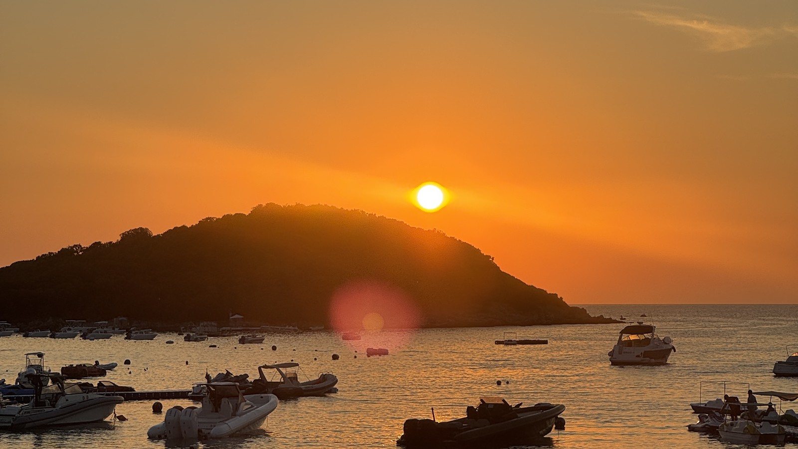 Sunset over the islands seen from a restaurant terrace in Ksamil, Albania