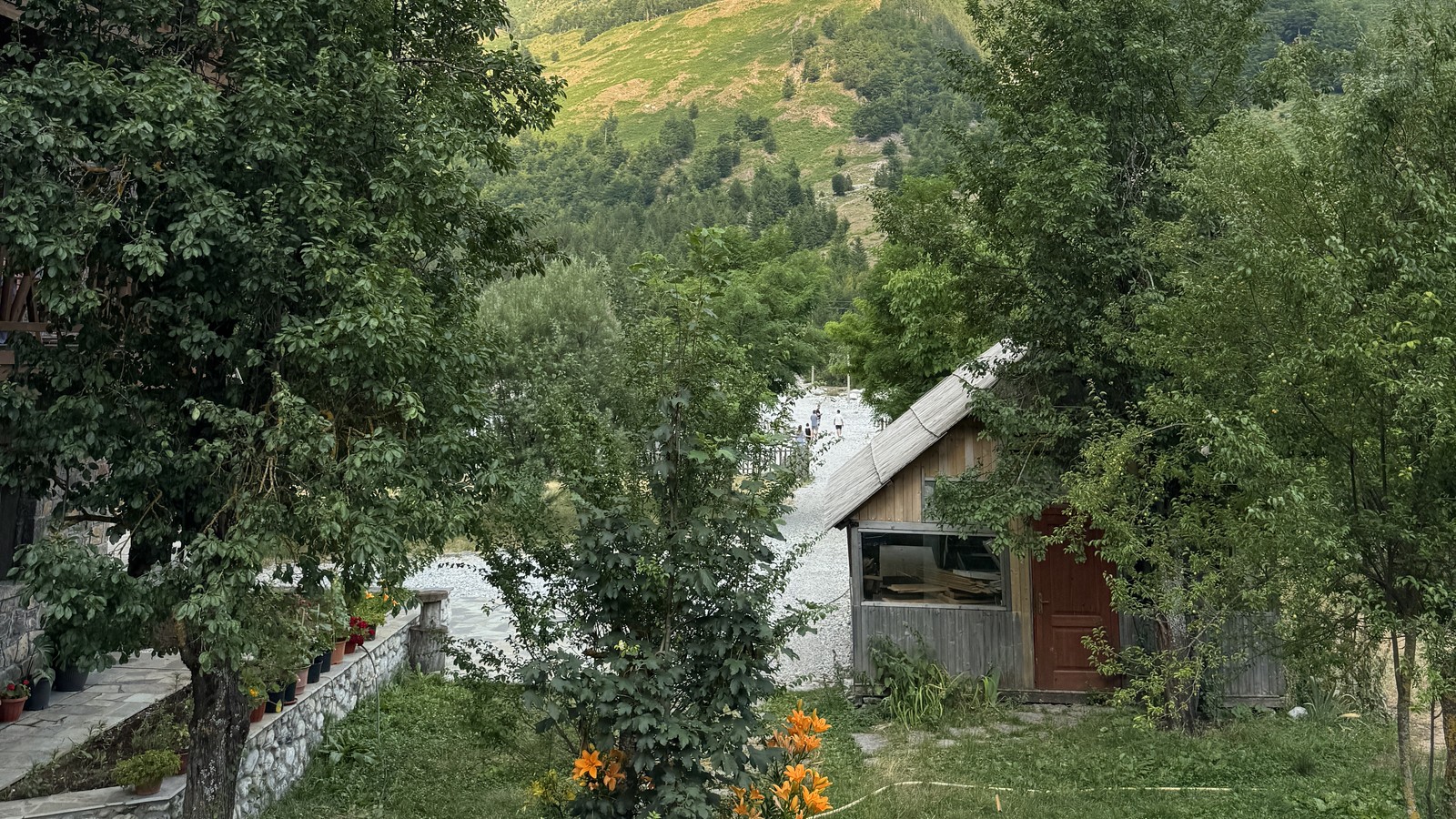 Guesthouse and garden below the mountains in the Valbone valley, Albania