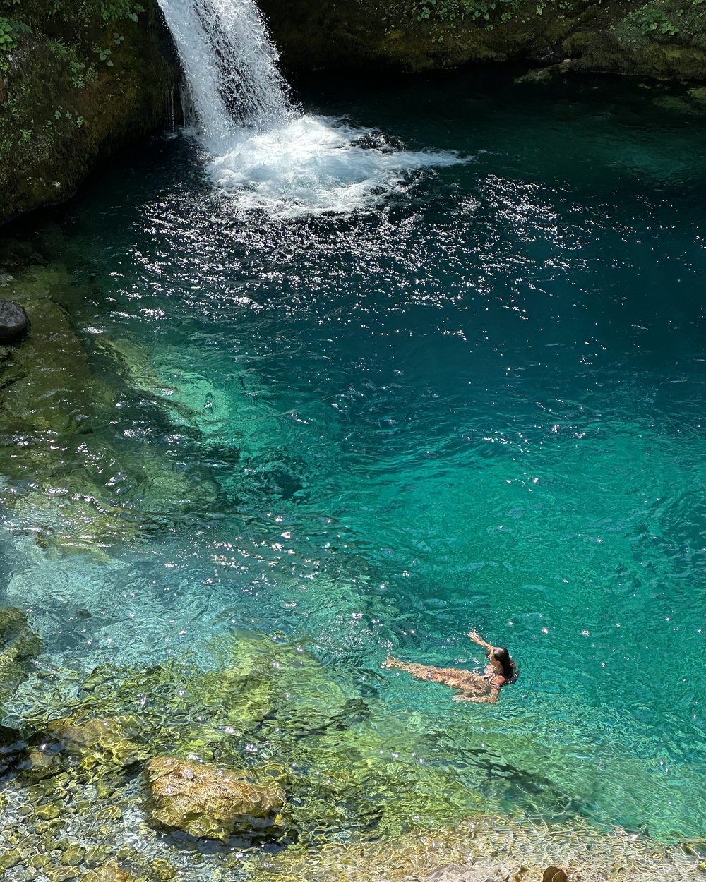 Swimming in the turquoise water of the Blue Eye near Theth in the Albanian Alps