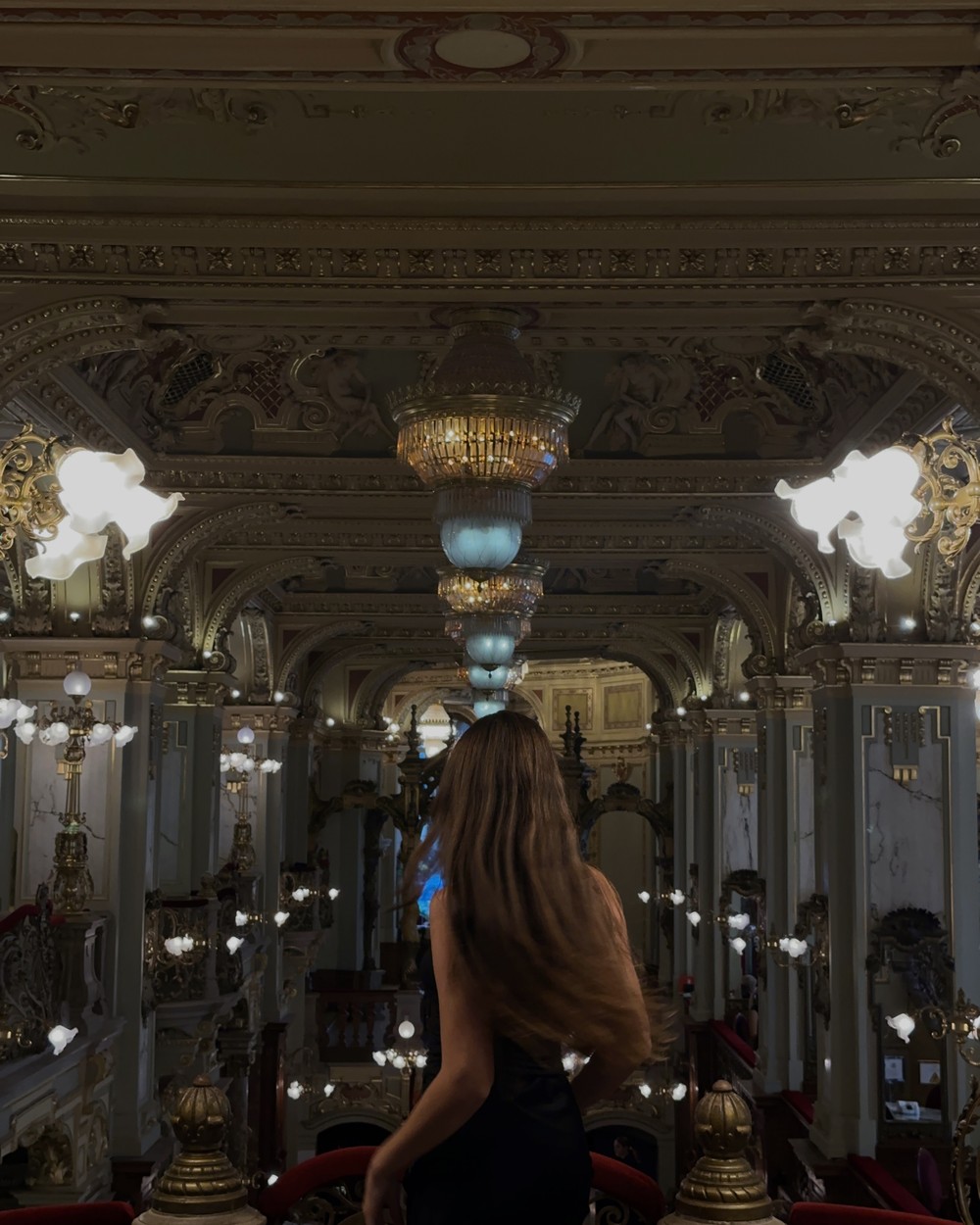 Ellen in a grand cafe in Budapest