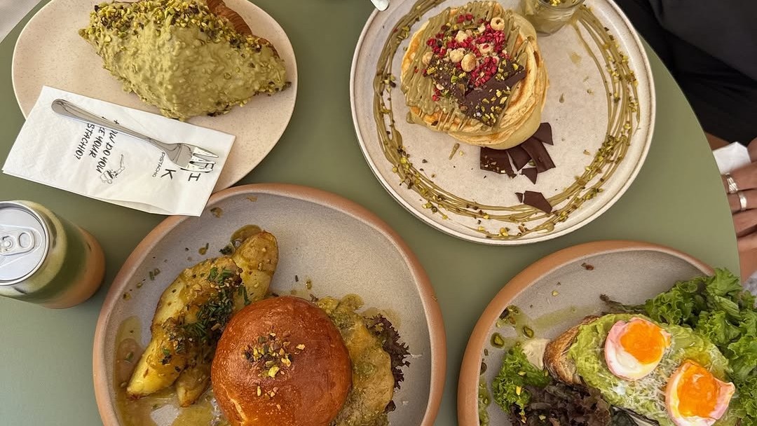 Pistachio pancakes and brunch plates at Pink Pistachio in Budapest