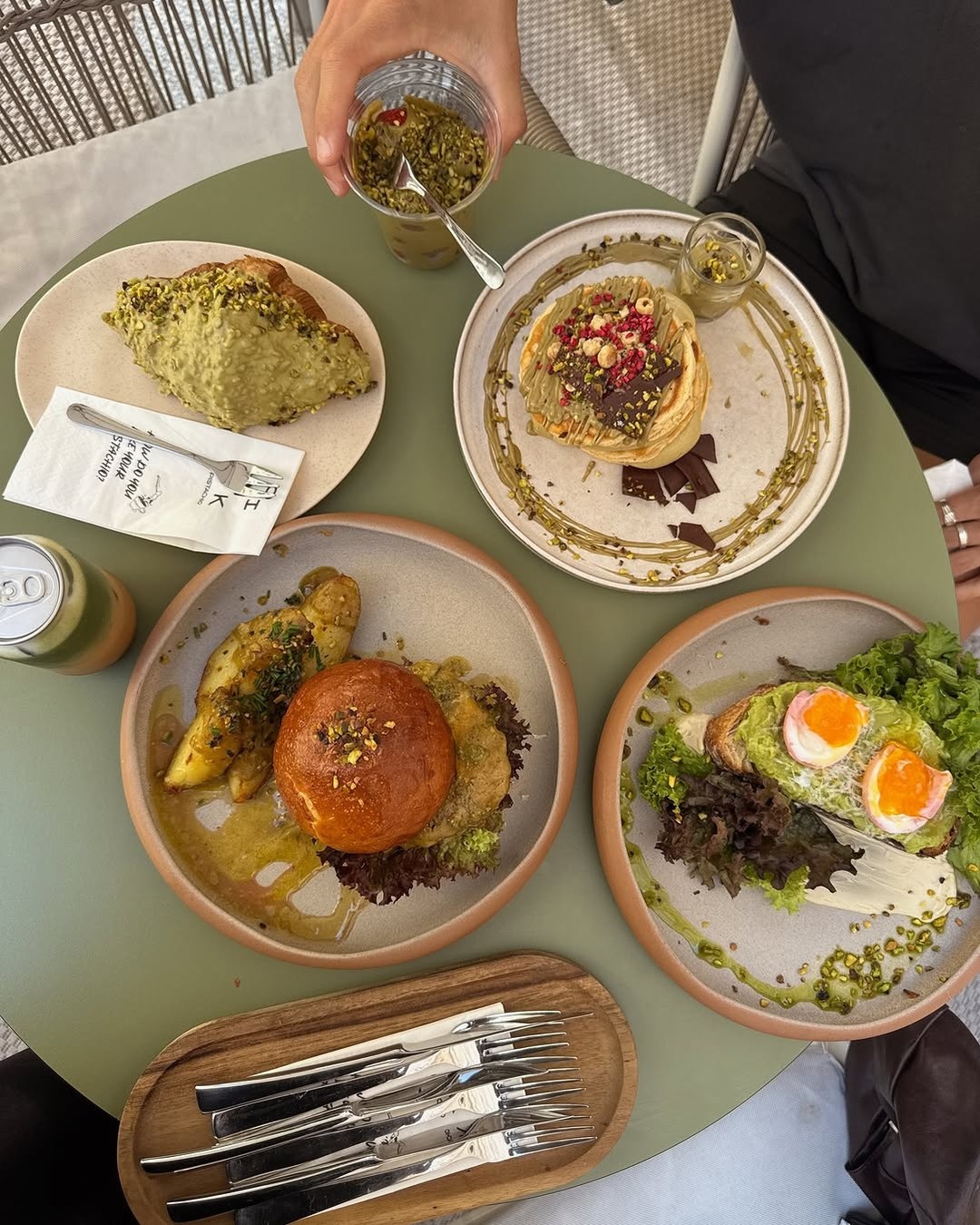 Pistachio pancakes and brunch plates at Pink Pistachio in Budapest