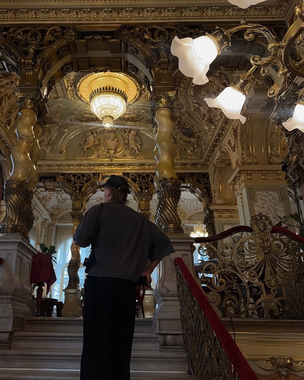 Ornate staircase and gilded interior of New York Cafe in Budapest