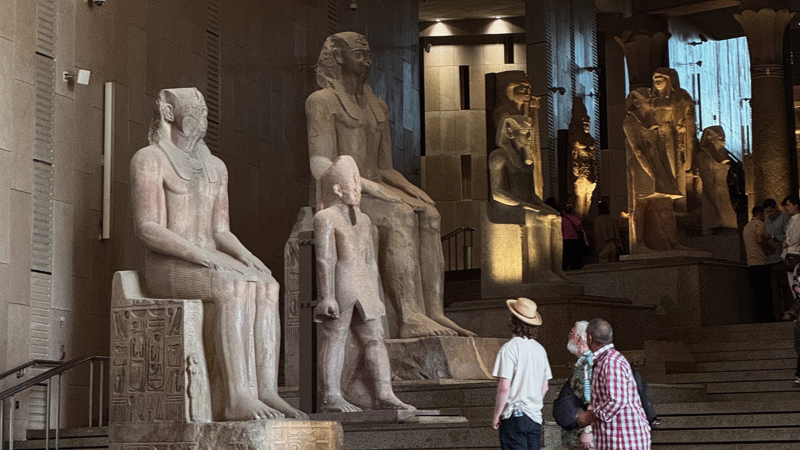 Ancient Egyptian statues inside the Grand Egyptian Museum in Giza