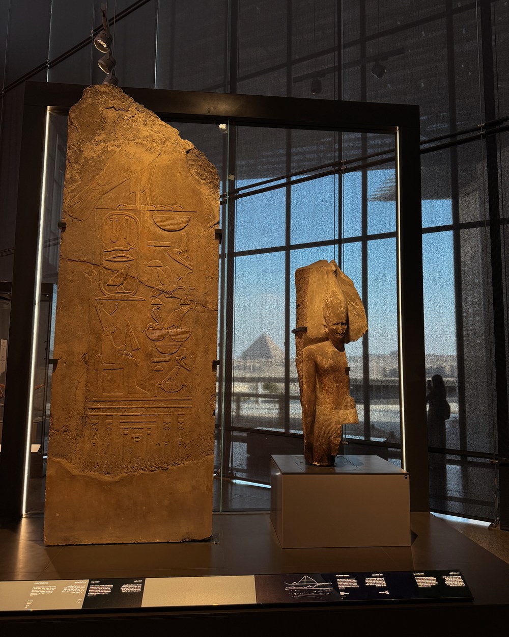 Ancient Egyptian artefacts displayed inside the Grand Egyptian Museum in Giza