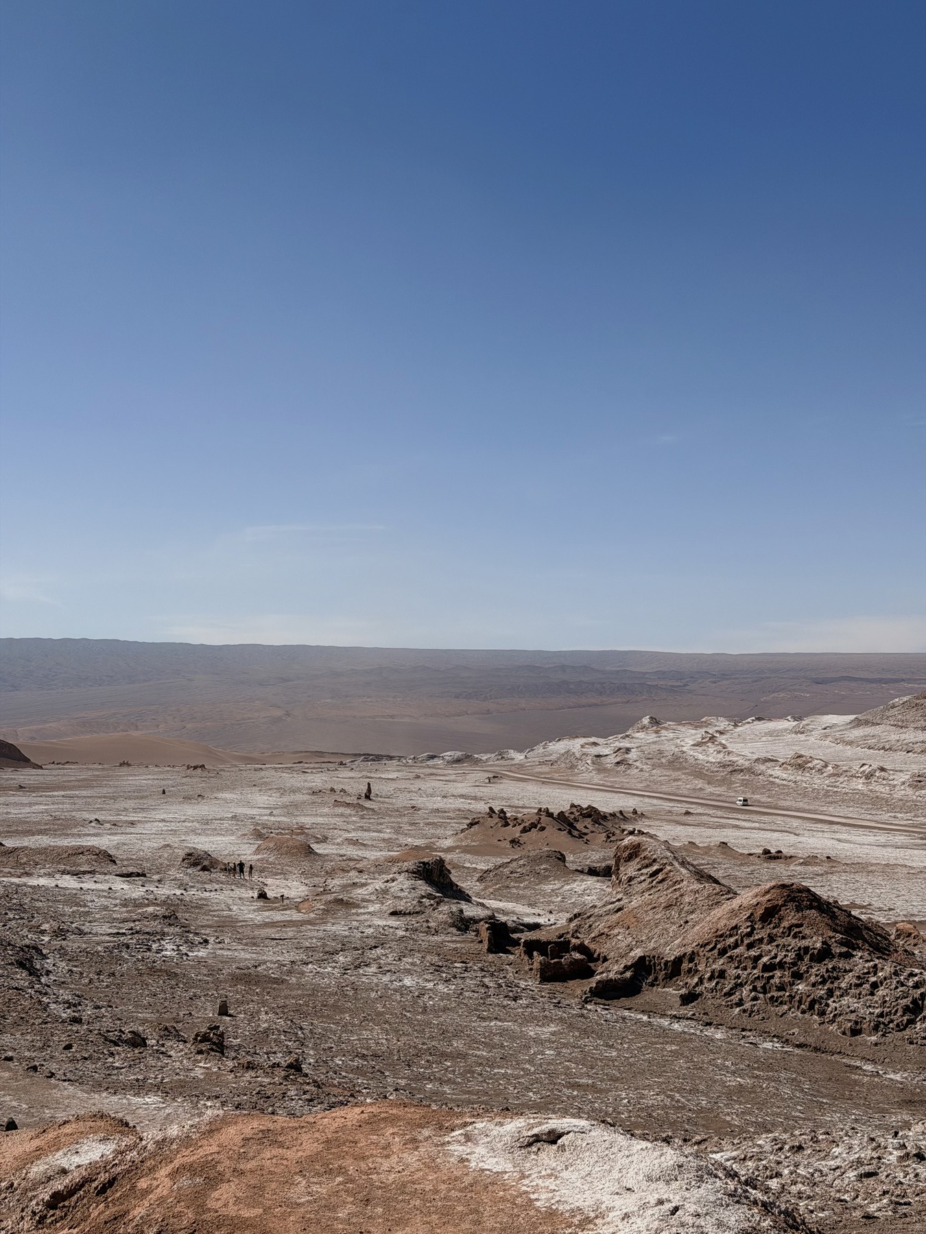 Salt deposits across rocky ground in the Atacama Desert