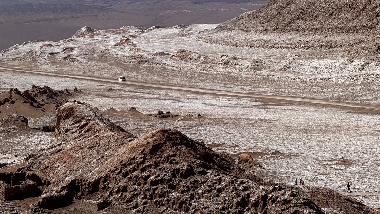 Pale salt deposits and layered rock in Valle de la Luna, Chile