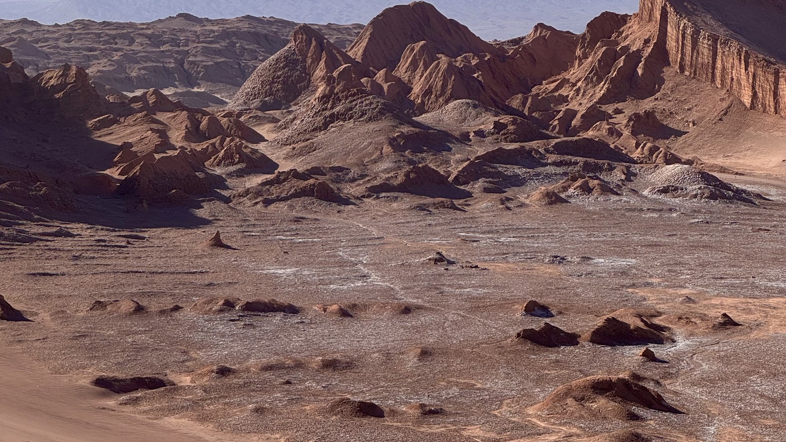 Sand dunes and rugged ridges in Valle de la Luna near San Pedro de Atacama