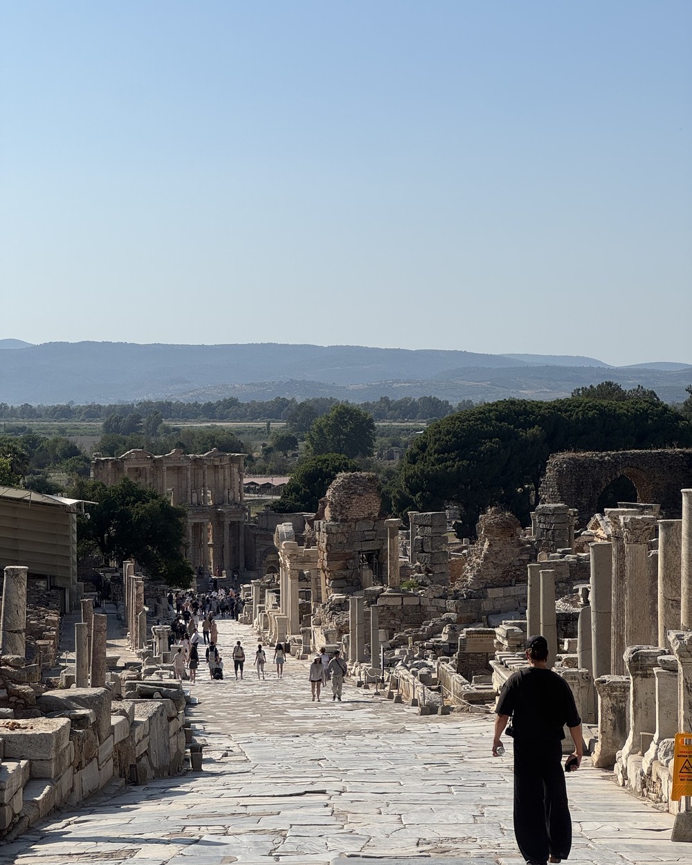 Marble paved street running through the ruins of the ancient city of Ephesus