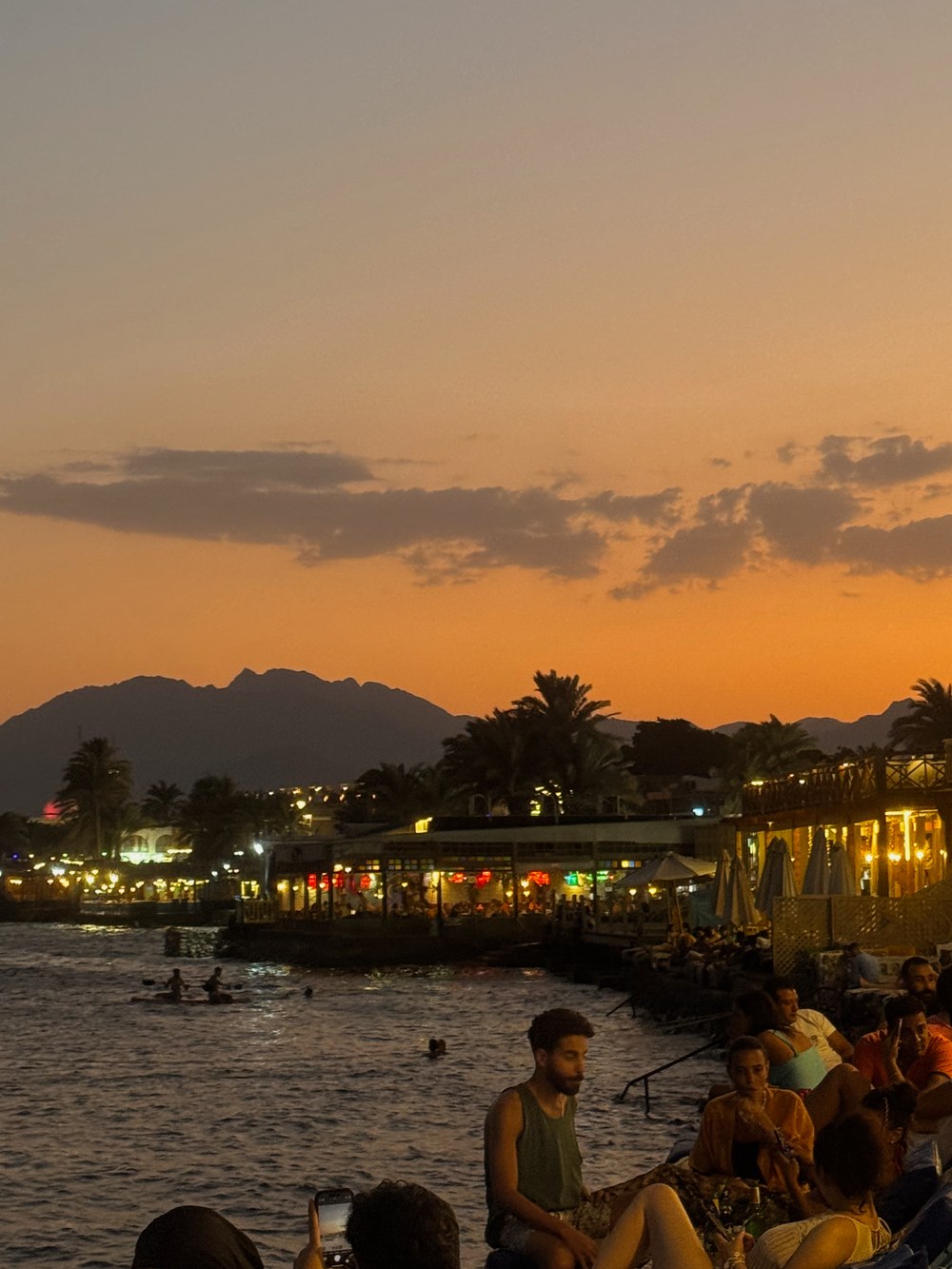 Dahab waterfront restaurants beneath the Sinai mountains at sunset