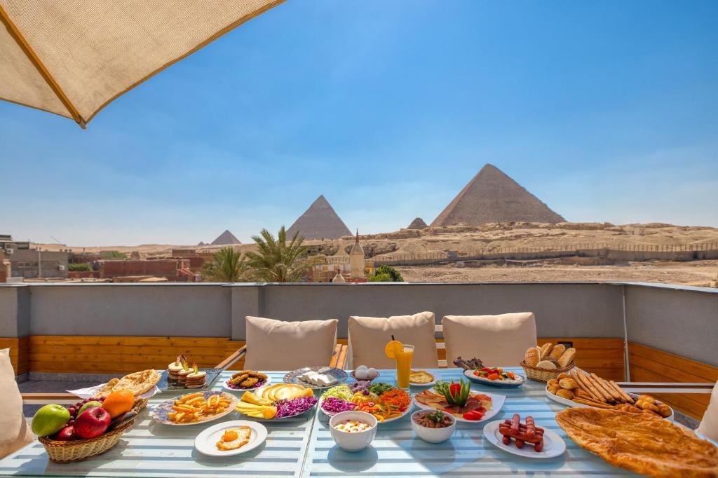 Pyramid-view terrace at The Stay Pyramids Inn in Giza
