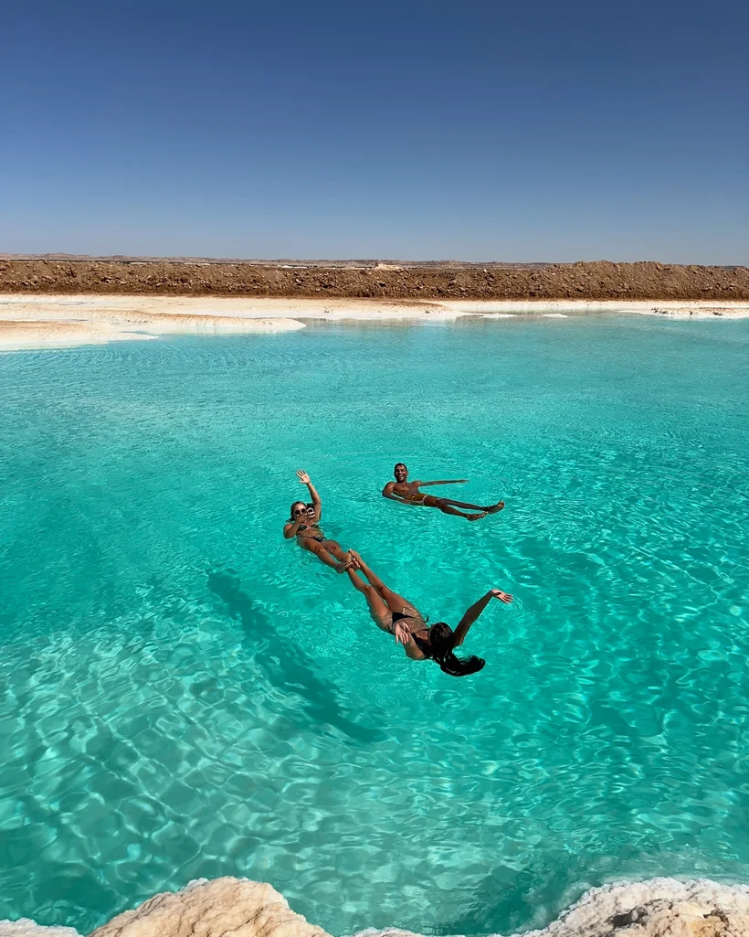 Floating in the Siwa salt lakes, Egypt