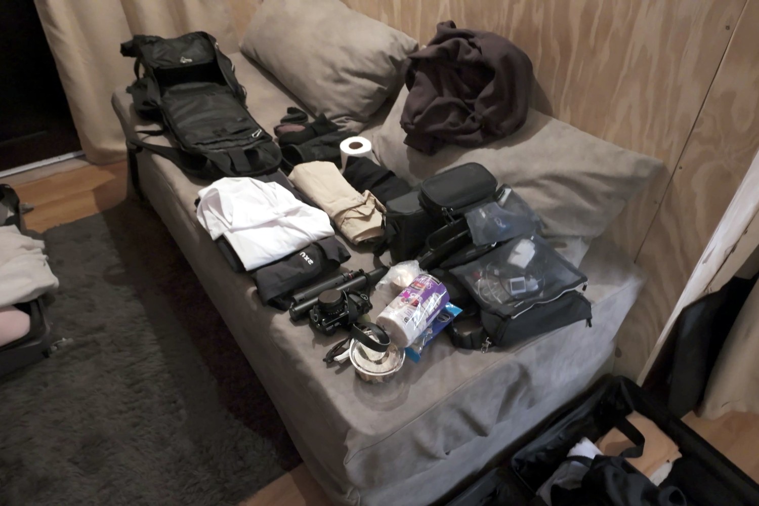 Our hiking gear laid out on the bed in the cabin the night before