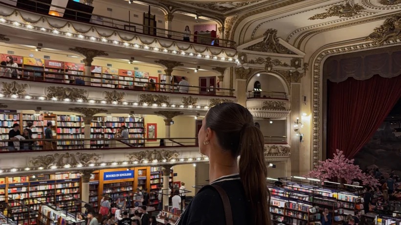 Ellen looking across the bookshelves inside El Ateneo Grand Splendid in Buenos Aires