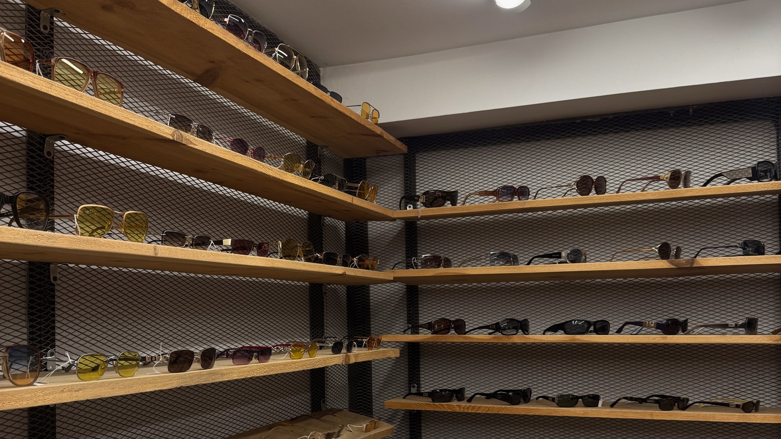 Rails and shelves of vintage clothing and sunglasses in a shop in Galata, Istanbul