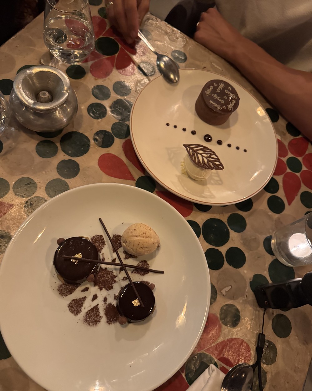 Plated chocolate desserts on a decorated table at Safran restaurant in Marrakech, Morocco