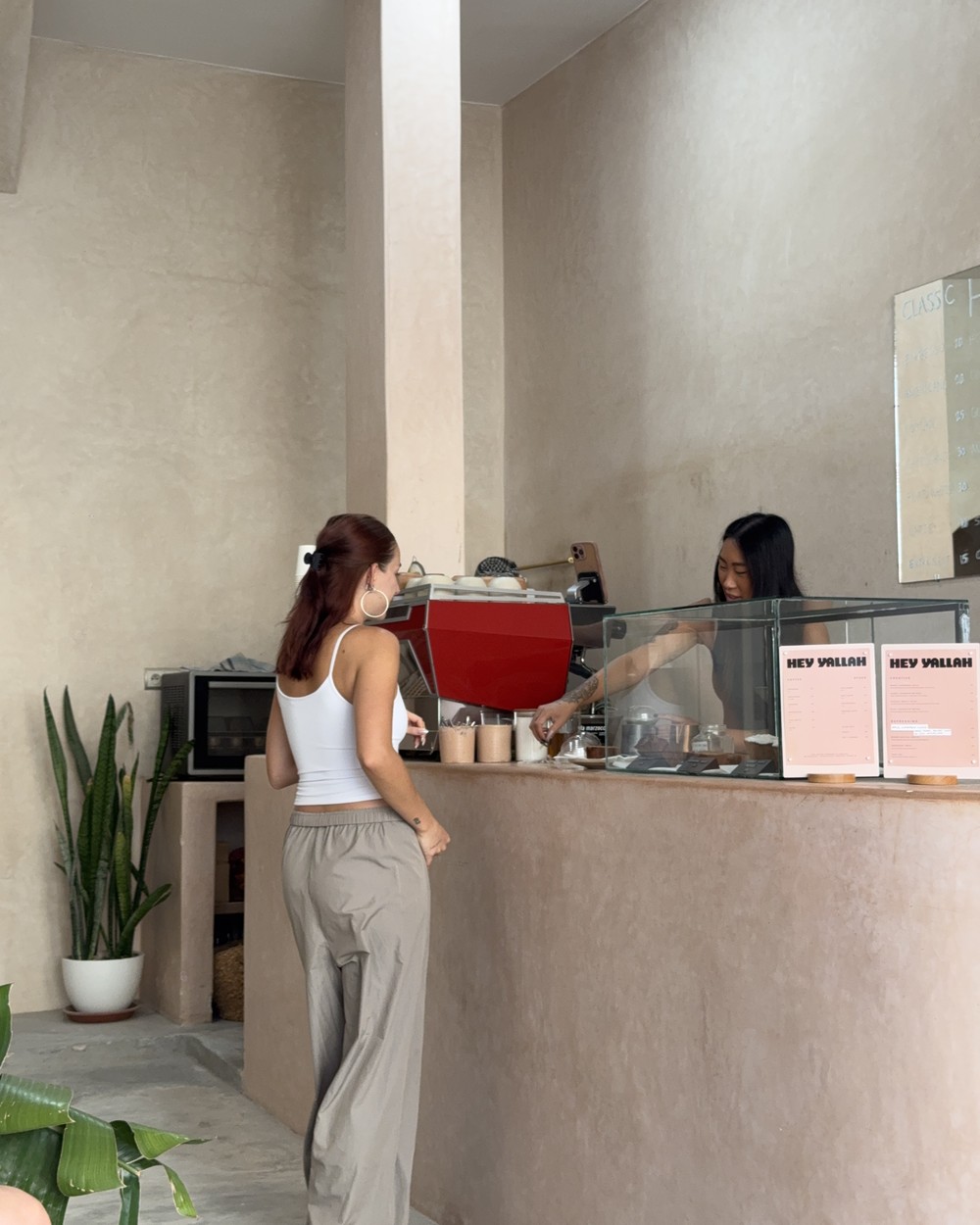 Counter and coffee machine at the Hey Yallah cafe in Tamraght, Morocco