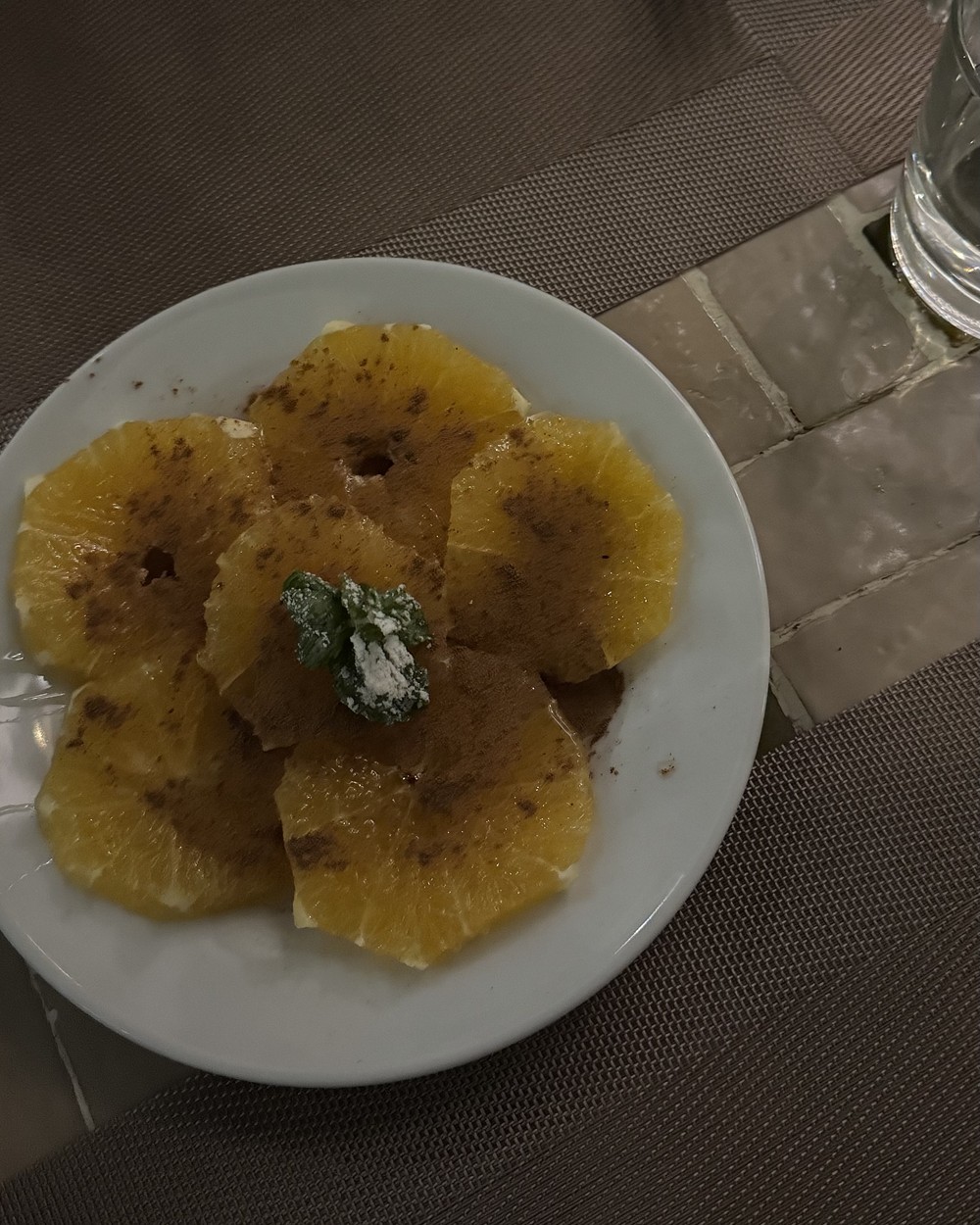 Sliced orange dusted with cinnamon and served as a simple dessert in Marrakech, Morocco