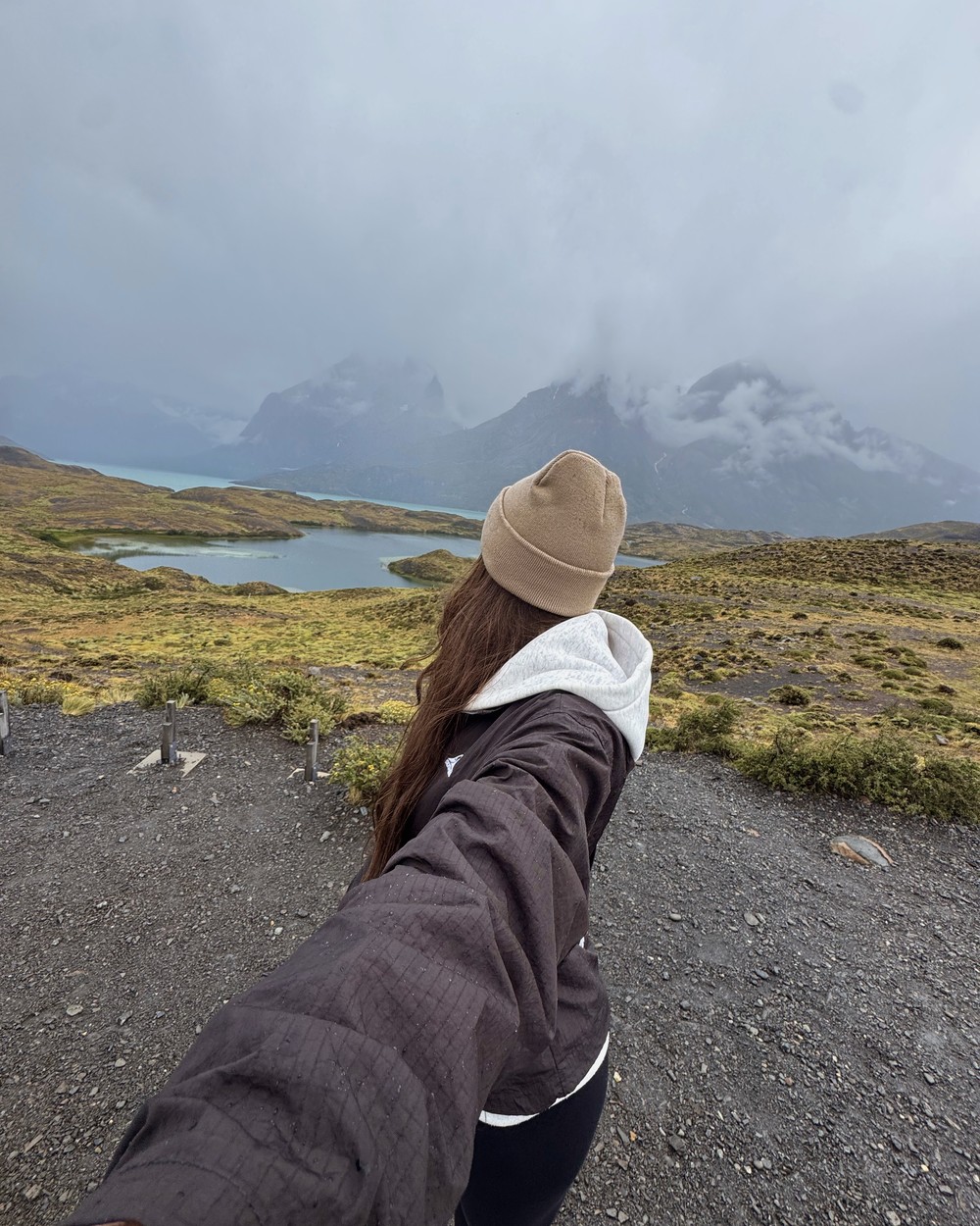 Ellen at a viewpoint in Torres del Paine National Park under cloud