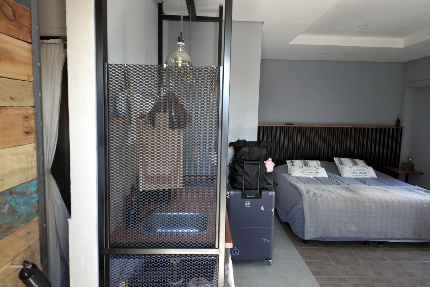 The double bed and mesh-screened kitchen in our second Airbnb near the El Calafate bus terminal