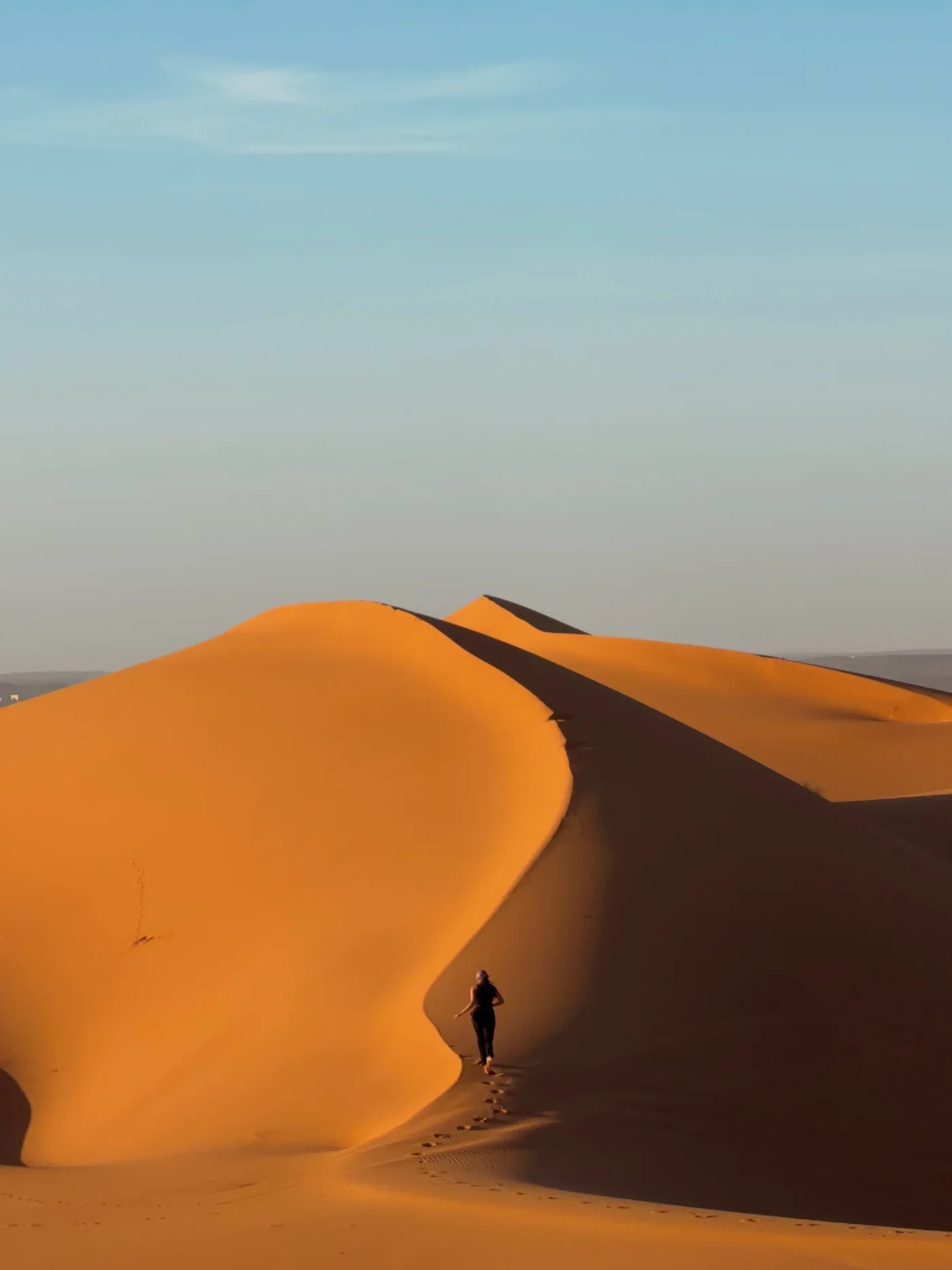Ellen walking the dunes of the Sahara desert