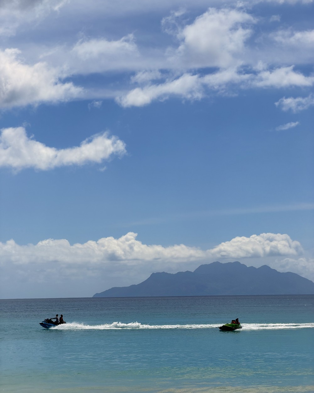 Calm water and palms at Beau Vallon beach on Mahe near our two accommodation bases