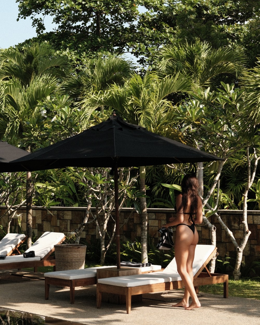 Open sided pavilion looking out over a long lap pool at M Beach House, Mawella, Sri Lanka