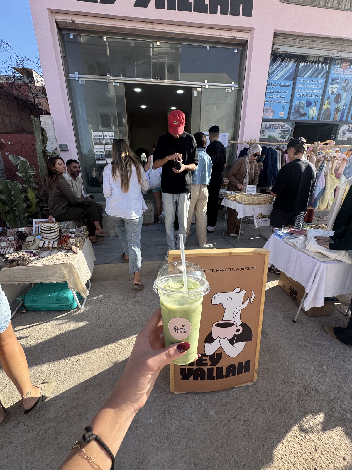 A drink held outside Hey Yallah on the Moroccan coast