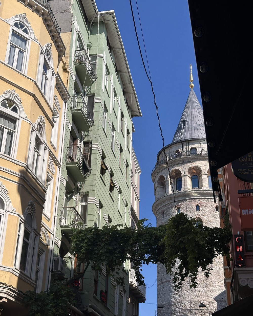 The Galata Tower rising above the streets and buildings of Istanbul