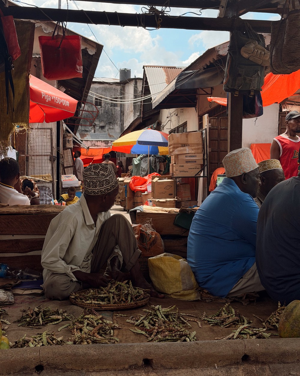 Traders sorting spices at the market in Stone Town, Zanzibar