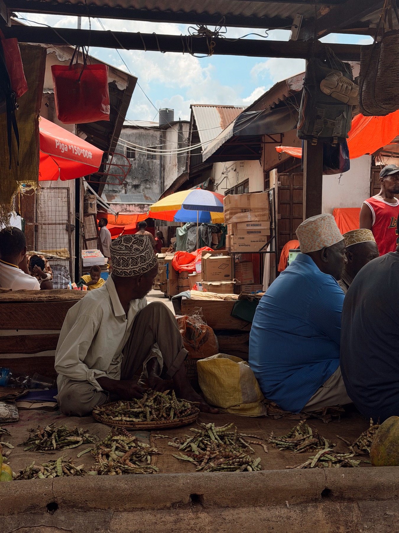 Produce stalls and vendors at the market in Stone Town