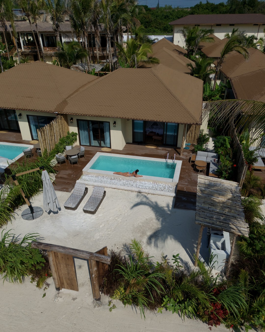 Aerial view of an oceanfront villa and private pool on the sand at Paje in Zanzibar