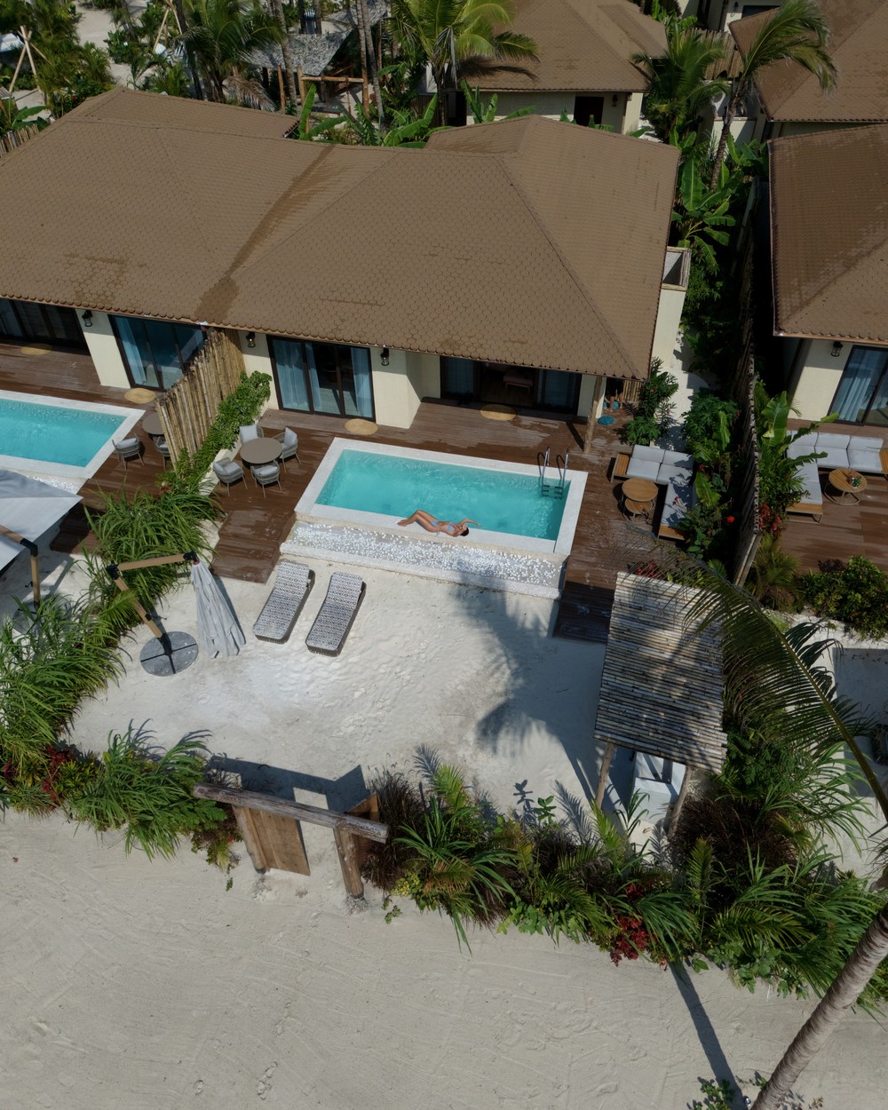 Aerial view of an oceanfront villa and private pool at ENVI Paje in Zanzibar
