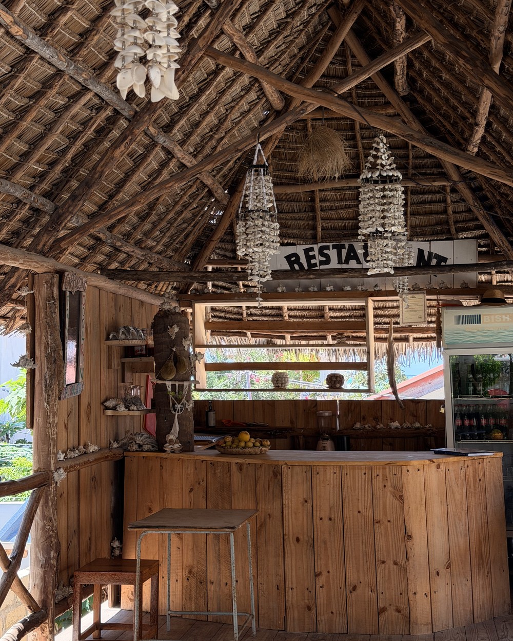 Inside a thatched beach bar and restaurant on the east coast of Zanzibar