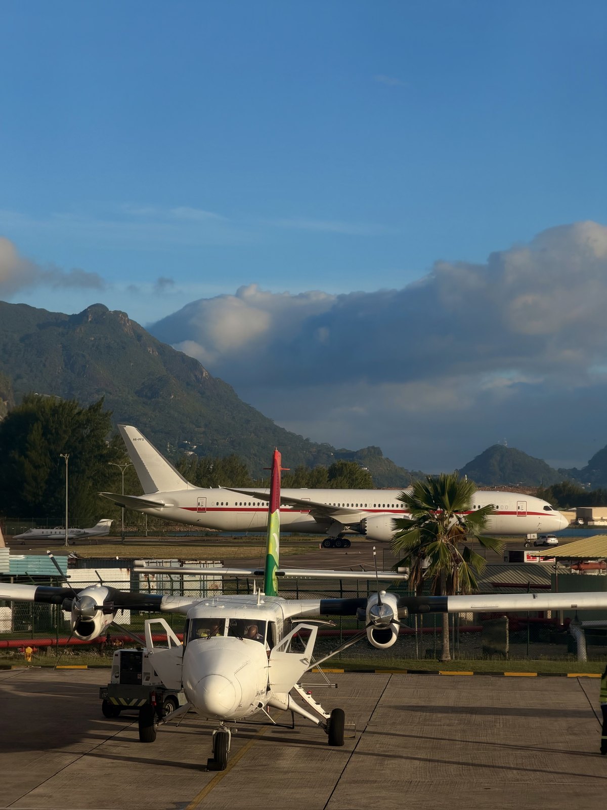 Small planes and the mountain backdrop at Seychelles International Airport on Mahe