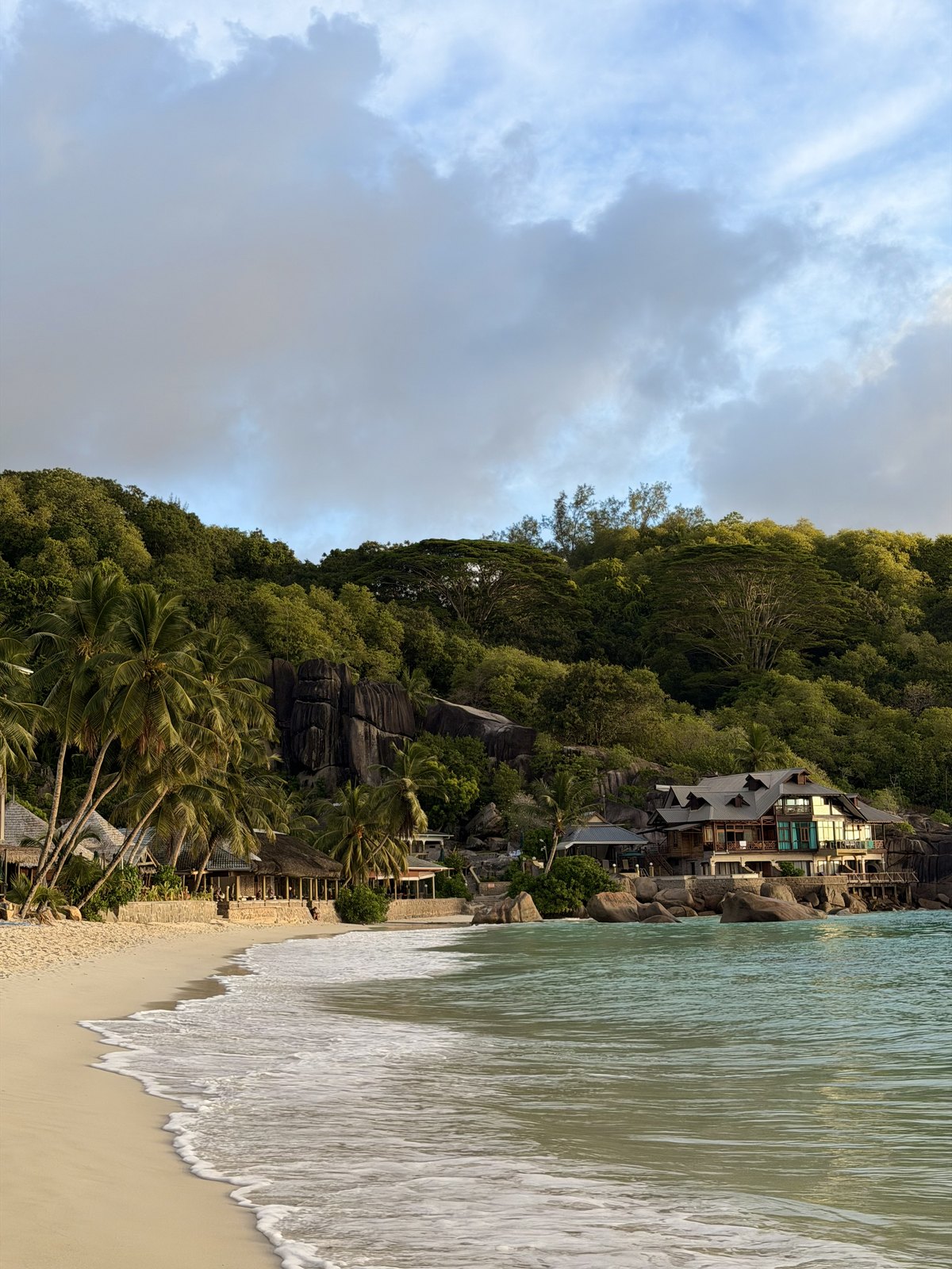 The palm-lined shoreline at Anse Takamaka during our Mahe hire-car days
