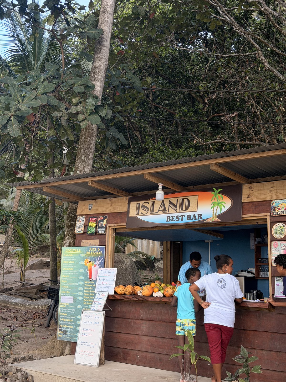 Beach bar beneath the palms on La Digue in Seychelles